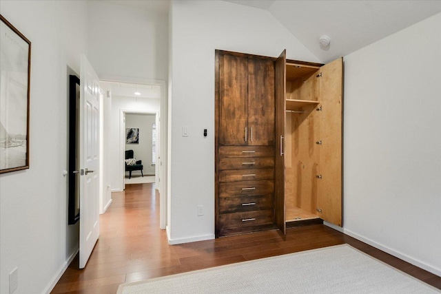 5908 Taylor Draper Cv, Austin, TX 78759 - unfurnished bedroom featuring dark wood-style floors, attic access, and lofted ceiling