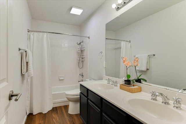 5908 Taylor Draper Cv, Austin, TX 78759 - full bathroom featuring shower / bath combo, double vanity, and wood finished floors