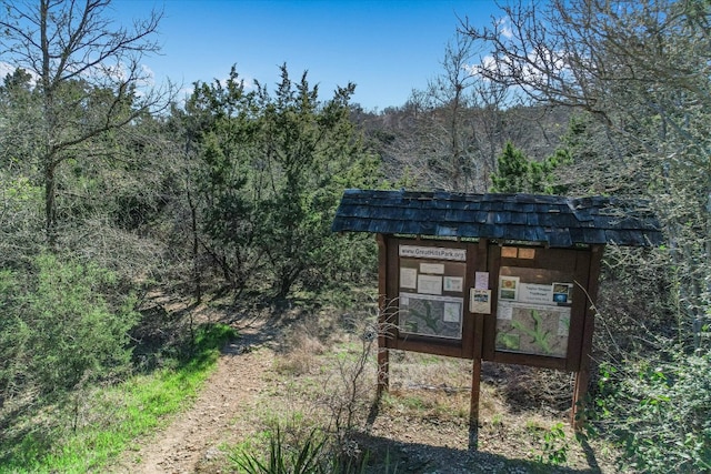 5908 Taylor Draper Cv, Austin, TX 78759 - view of outbuilding with a forest view