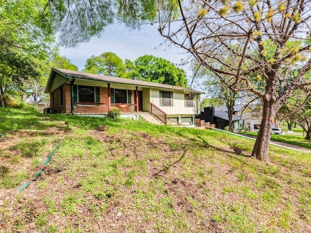 ranch-style house with brick siding