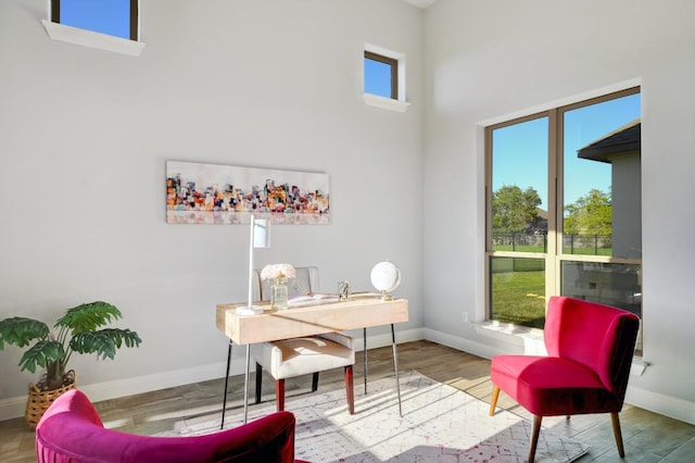 office area featuring baseboards and wood finished floors