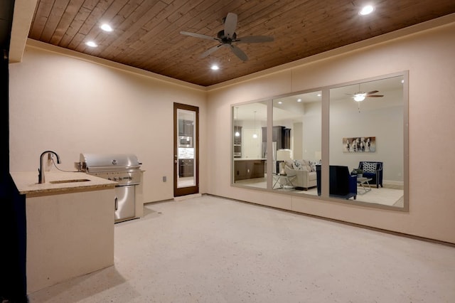 interior space featuring wooden ceiling, a ceiling fan, a sink, and recessed lighting