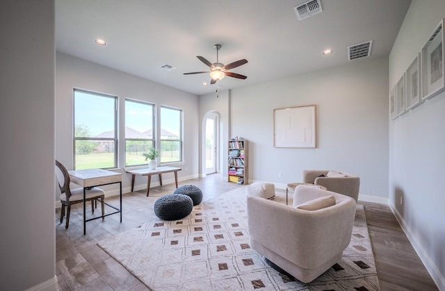 227 Dally Ct, Dripping Springs, TX 78620 - living room featuring baseboards, ceiling fan, recessed lighting, wood finished floors, and arched walkways