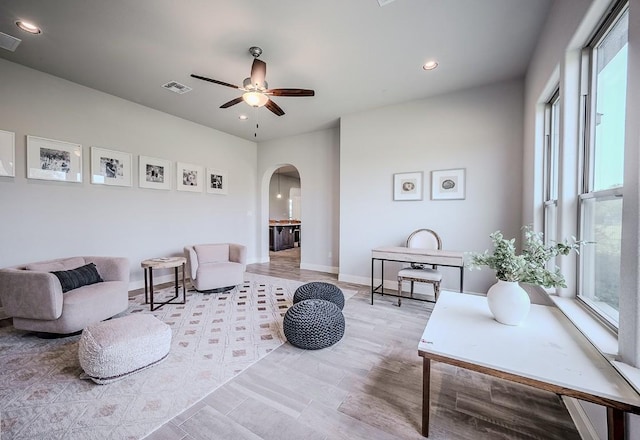 227 Dally Ct, Dripping Springs, TX 78620 - living area with arched walkways, ceiling fan, recessed lighting, and baseboards