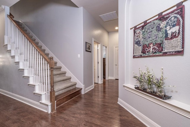 interior space featuring visible vents, baseboards, and wood finished floors