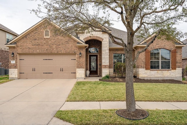 french country home featuring stone siding, brick siding, driveway, and an attached garage