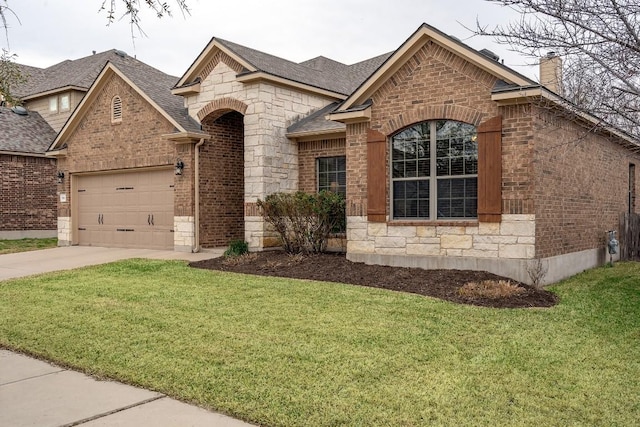 french country home with brick siding, concrete driveway, a garage, stone siding, and a front lawn