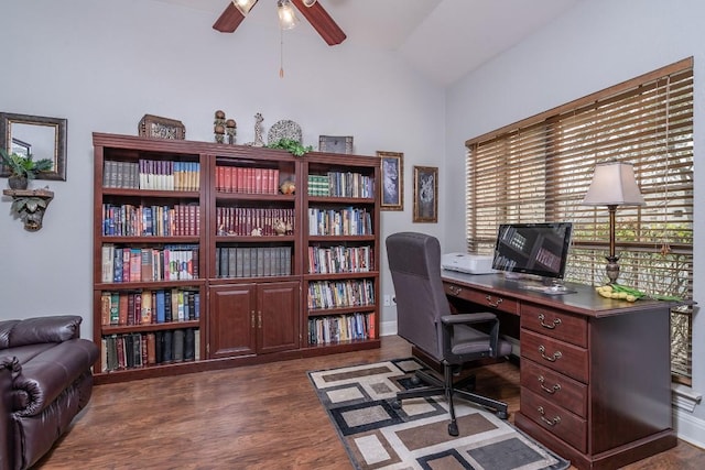 home office with vaulted ceiling, dark wood finished floors, and a ceiling fan