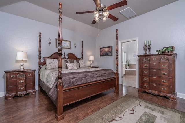 bedroom with baseboards, visible vents, ensuite bath, ceiling fan, and wood finished floors