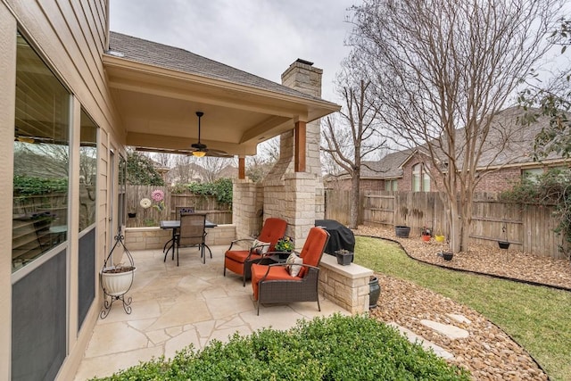 view of patio / terrace with a fenced backyard, a grill, and a ceiling fan