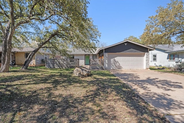 ranch-style home with a garage, a front yard, and driveway