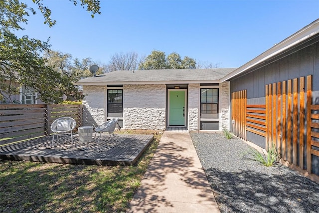 exterior space featuring stone siding