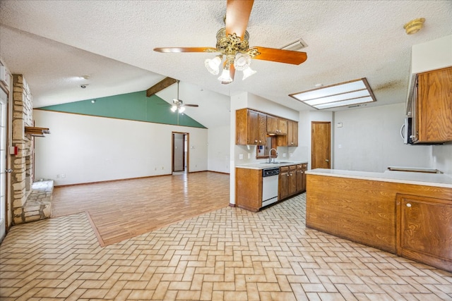 kitchen featuring brown cabinetry, open floor plan, white dishwasher, light countertops, and a sink