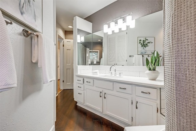 1709 Newfield Ln, Austin, TX 78703 - bathroom with vanity and wood finished floors