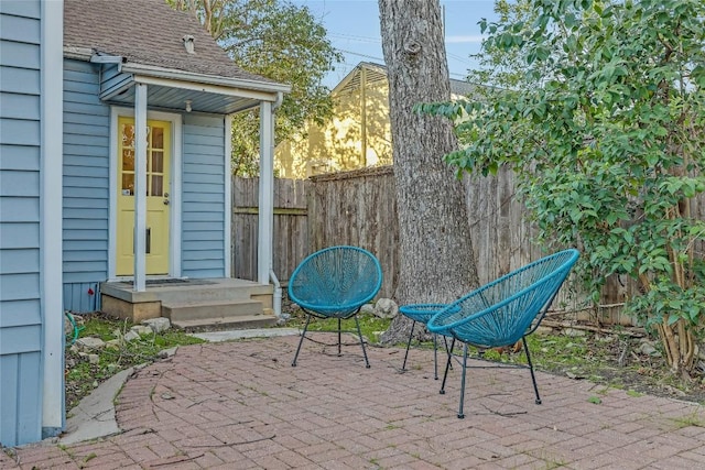 view of patio featuring fence