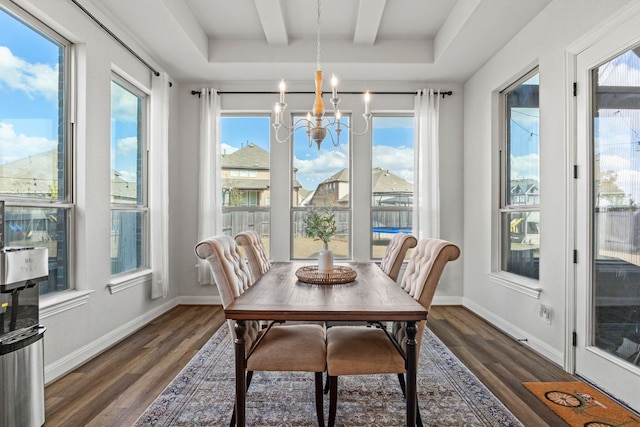 sunroom with beam ceiling and an inviting chandelier