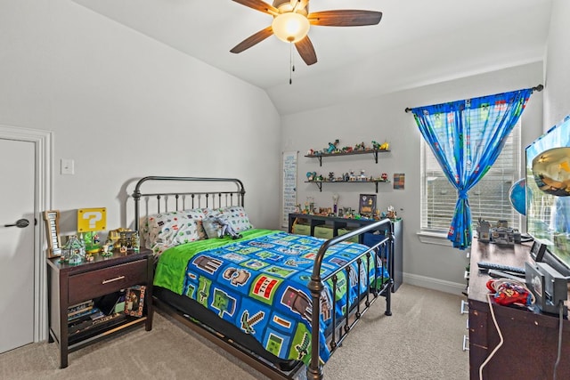 bedroom featuring a ceiling fan, carpet, vaulted ceiling, and baseboards