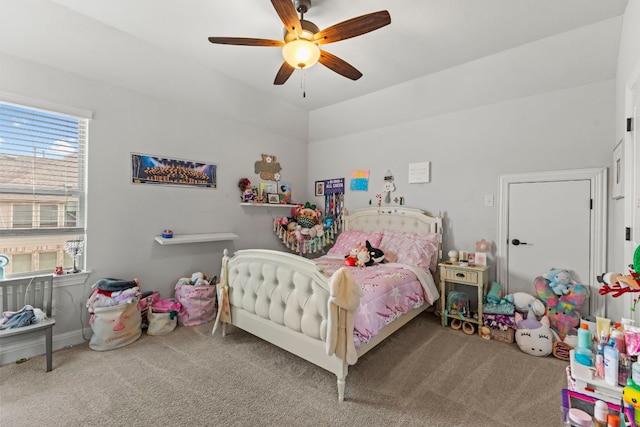 bedroom featuring vaulted ceiling, carpet flooring, and ceiling fan