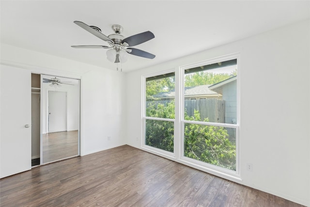 unfurnished room featuring ceiling fan and wood finished floors