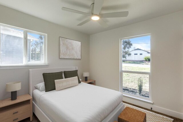 6401 Cooper Ln, Austin, TX 78745 - bedroom featuring ceiling fan and baseboards