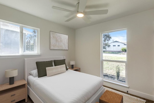 6401 Cooper Ln, Austin, TX 78745 - bedroom with a ceiling fan and baseboards