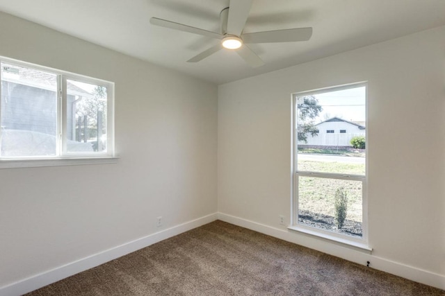 empty room featuring ceiling fan, baseboards, and carpet flooring