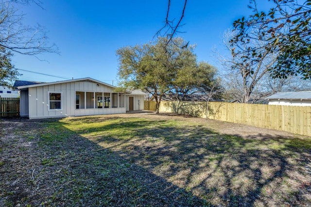 6401 Cooper Ln, Austin, TX 78745 - rear view of house with board and batten siding
