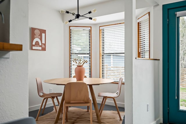 dining room featuring baseboards