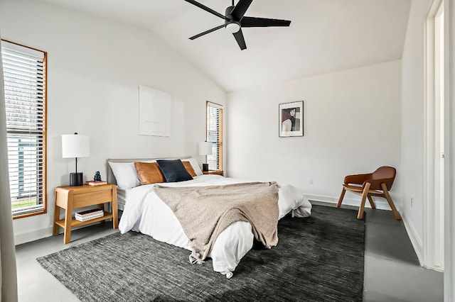 bedroom with lofted ceiling, ceiling fan, and baseboards