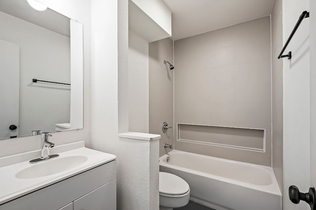 full bathroom featuring vanity, bathtub / shower combination, and toilet