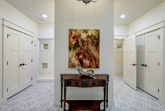 foyer with recessed lighting and visible vents
