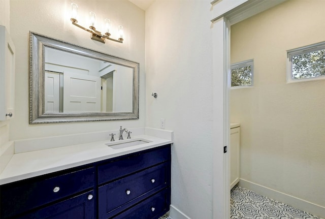 bathroom featuring vanity and baseboards