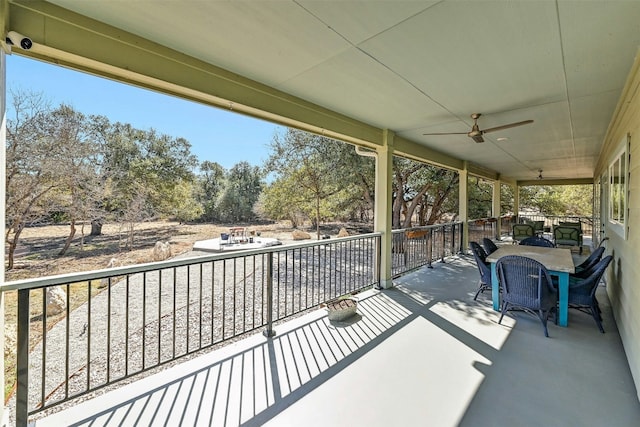 exterior space featuring a ceiling fan
