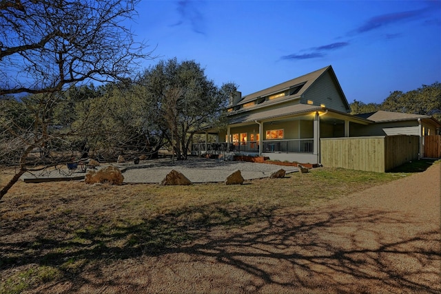 view of home's exterior with fence