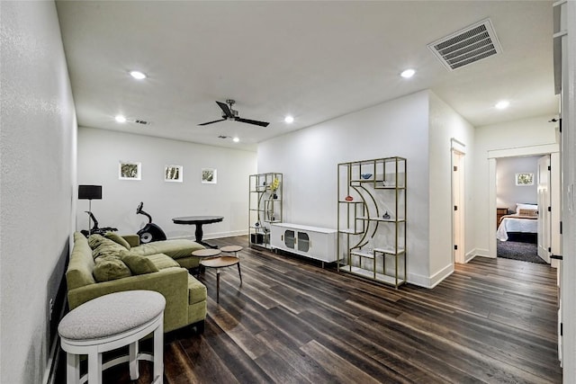 living room featuring visible vents, baseboards, ceiling fan, dark wood finished floors, and recessed lighting