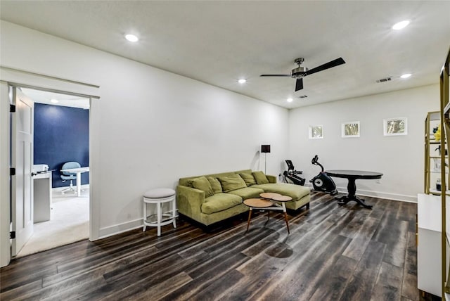 living area with recessed lighting, dark wood-type flooring, and ceiling fan