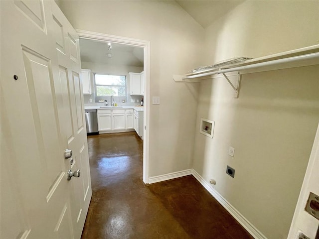 laundry room featuring laundry area, washer hookup, a sink, baseboards, and electric dryer hookup