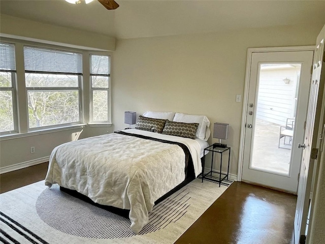 bedroom with multiple windows, baseboards, and a ceiling fan