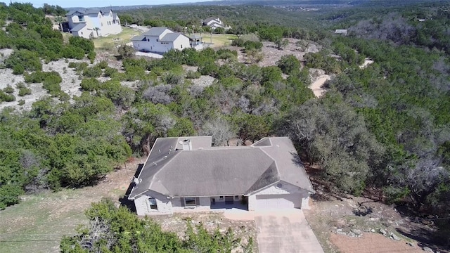 drone / aerial view with a view of trees