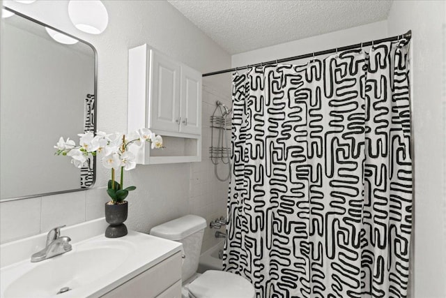 full bathroom featuring toilet, a textured ceiling, vanity, and shower / tub combo