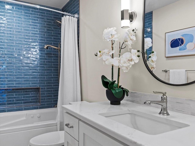 bathroom with toilet, vanity, and shower / tub combo with curtain