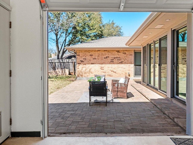 view of patio featuring fence and visible vents