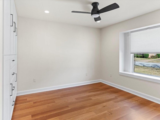 unfurnished room with recessed lighting, baseboards, light wood-style floors, and ceiling fan