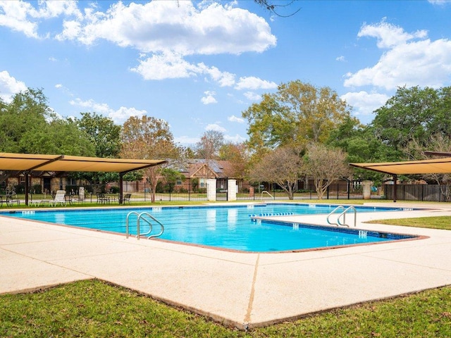 pool featuring a patio area and fence