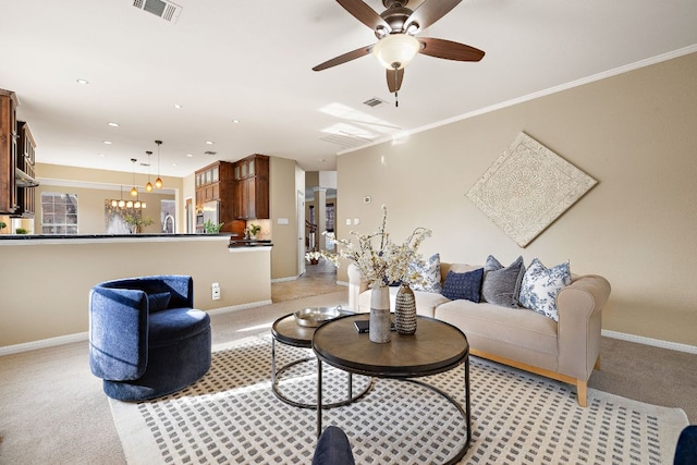 living room featuring light colored carpet, visible vents, and baseboards