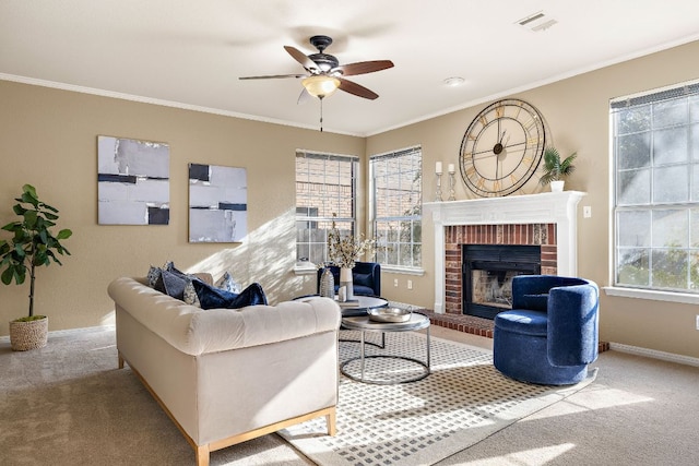 carpeted living area with a ceiling fan, visible vents, baseboards, ornamental molding, and a brick fireplace