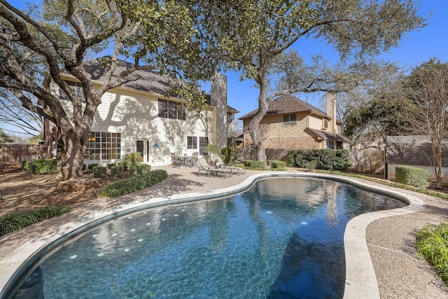 view of pool featuring a patio area and a fenced backyard