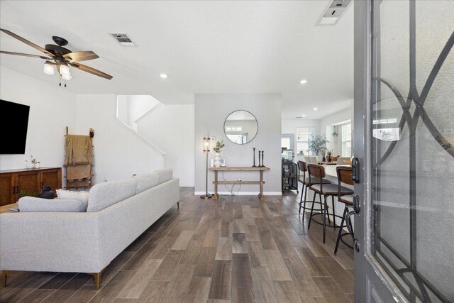 living room with visible vents, recessed lighting, a ceiling fan, and wood tiled floor