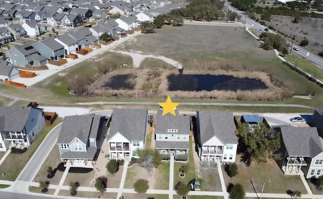 birds eye view of property with a residential view
