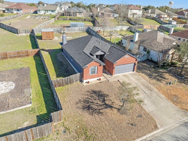 birds eye view of property with a residential view